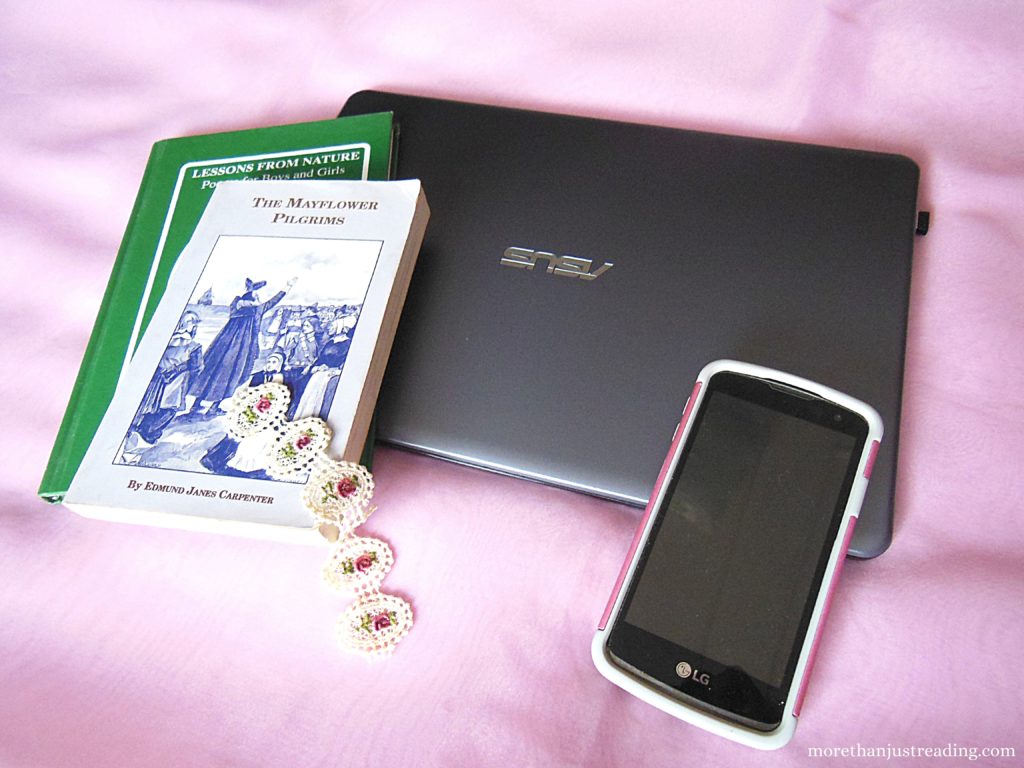 Books, a laptop, and a cellphone