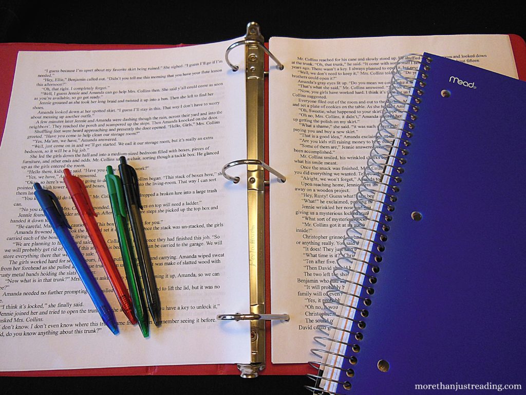 A notebook, paper in a binder, and colored inkpens | Creative writing