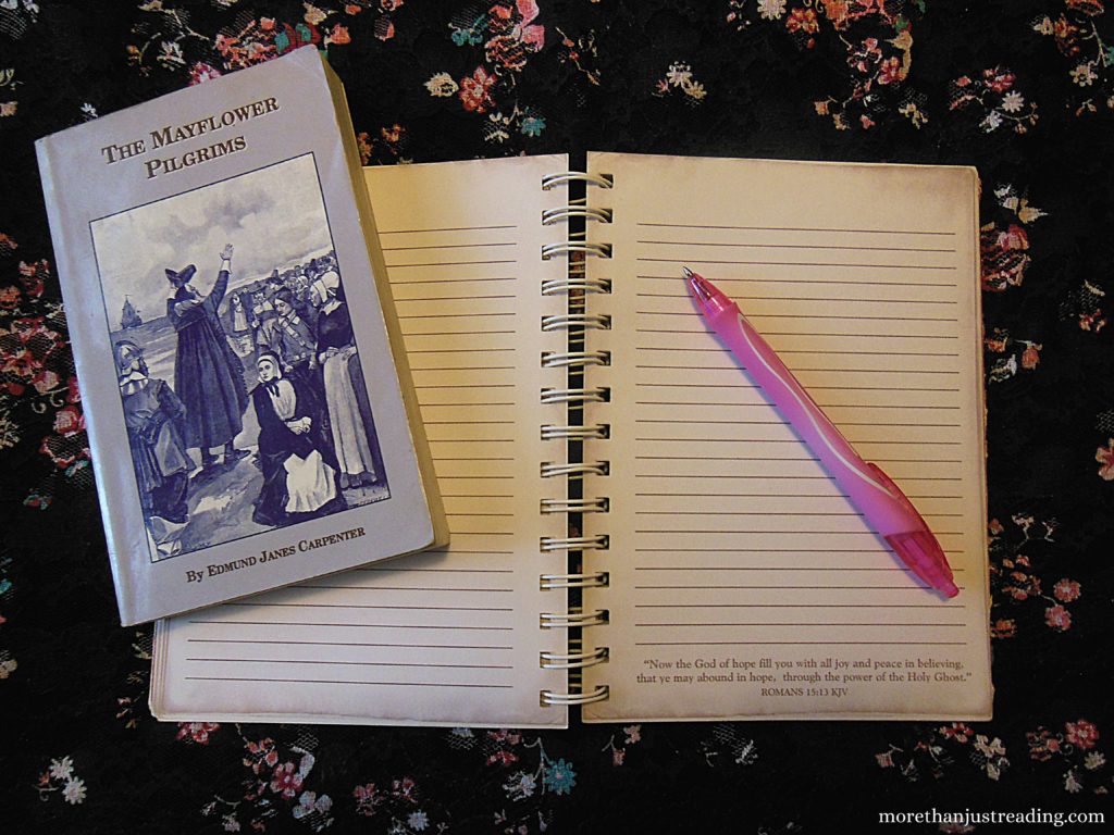 A notebook and pen and book