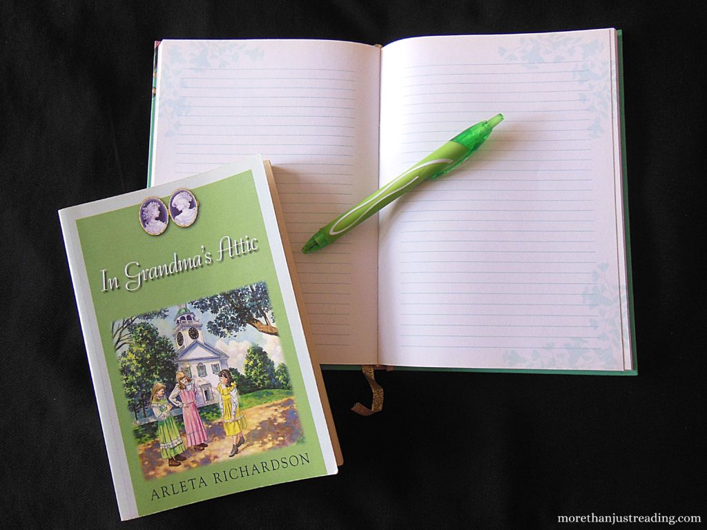 A notebook, pen, and book