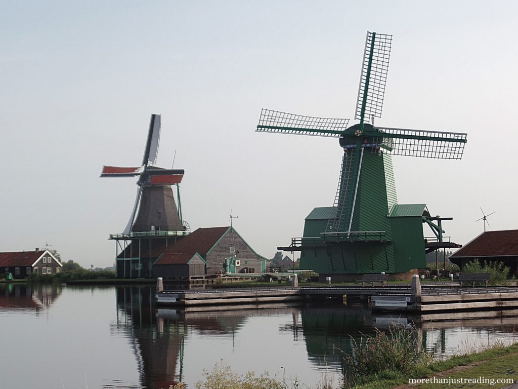 Dutch windmills next to a canal